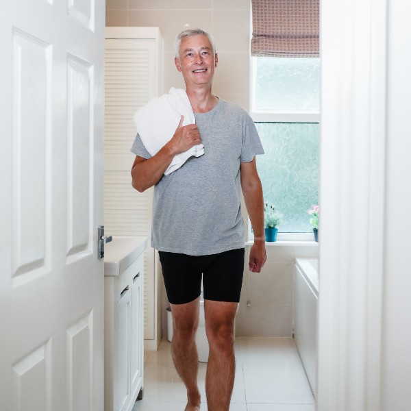 Man in washable incontinence pants