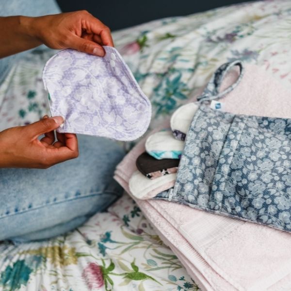 How do you clean reusable sanitary pads?